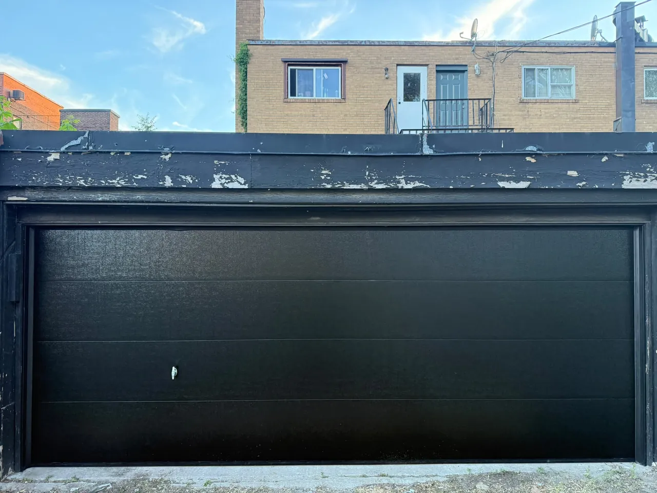 Black flush-panel garage door replacement — GTA