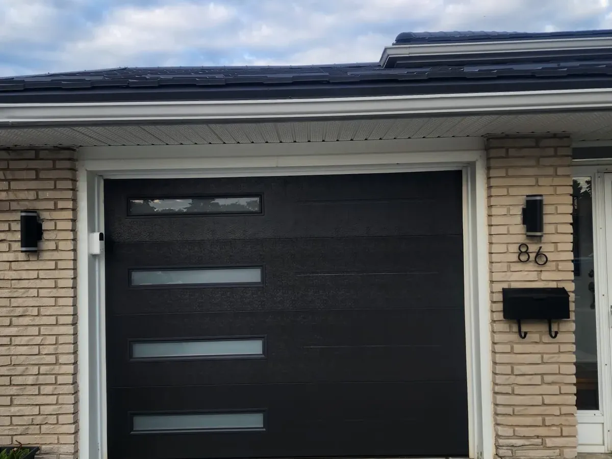 Black modern garage door with frosted glass inserts — Toronto