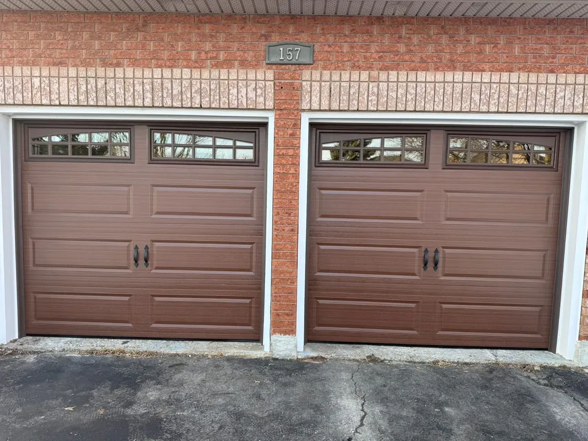 Brown double woodgrain carriage garage door with windows — Brampton