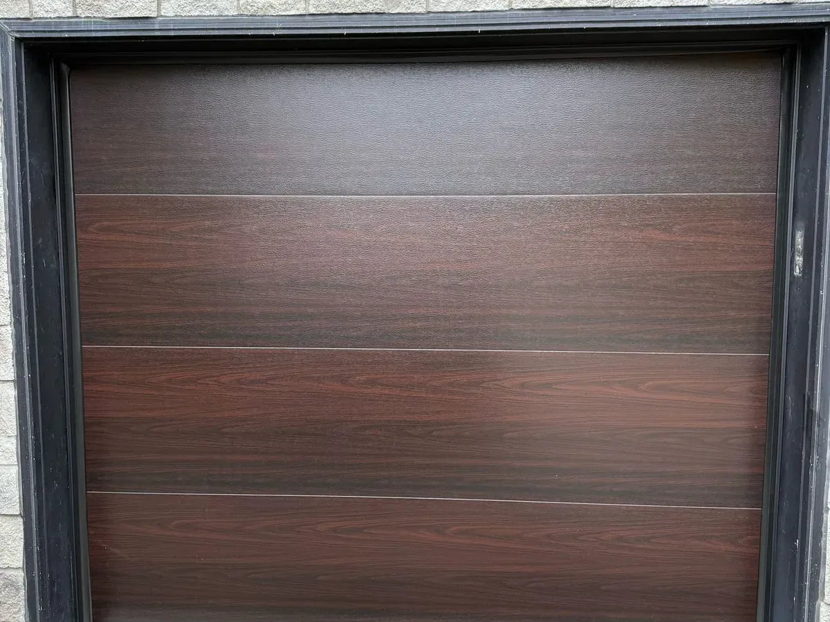 Carriage-style garage door with cross-beam detail — Mississauga