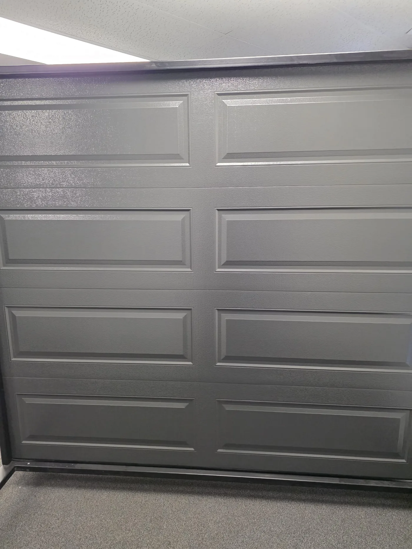 Charcoal long-panel single garage door, interior view — GTA