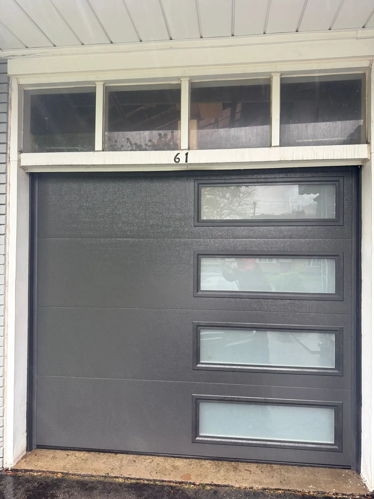 Charcoal modern flush-panel garage door with side windows — GTA