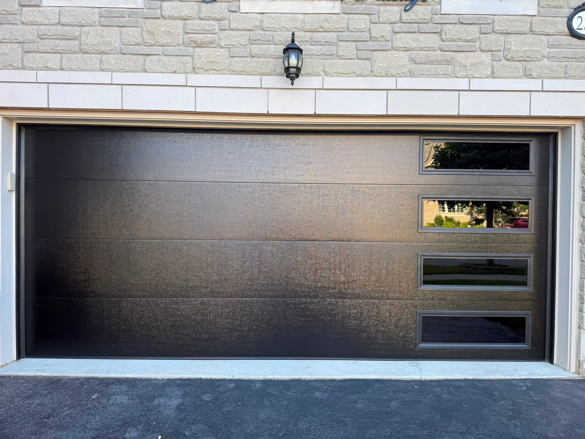 Dark brown modern flush-panel double garage door with side windows — GTA