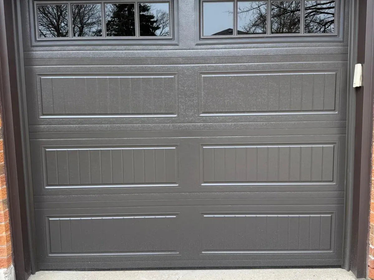 Dark grey single sectional garage door with windows — Vaughan
