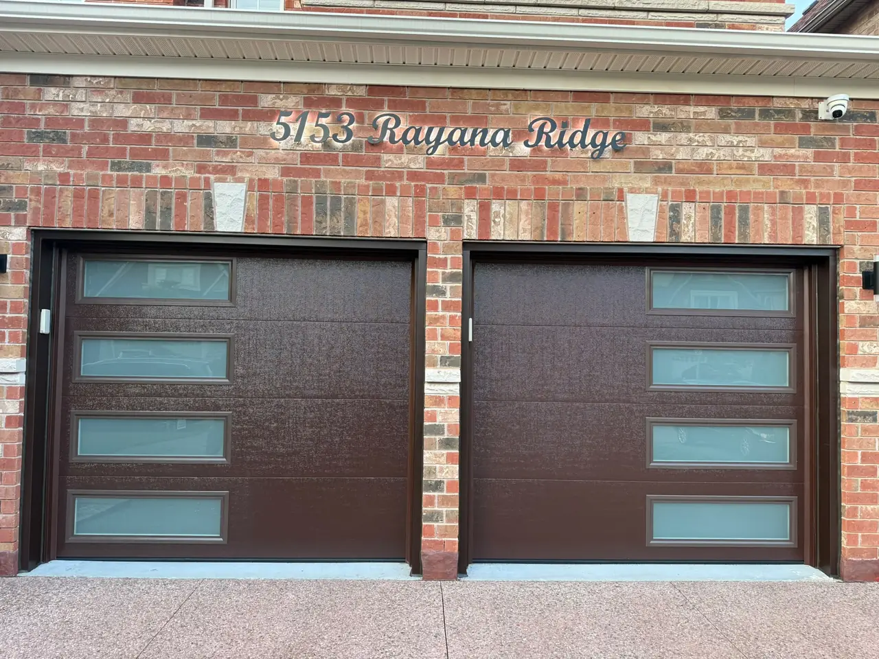 Espresso modern flush-panel double garage door with windows — GTA