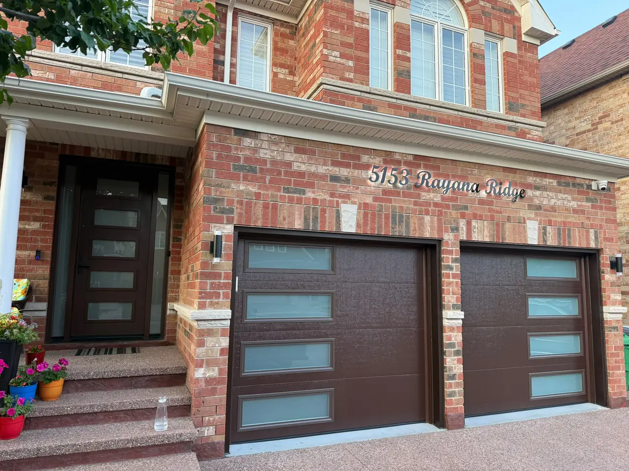 Espresso modern flush-panel garage door — full exterior view, GTA