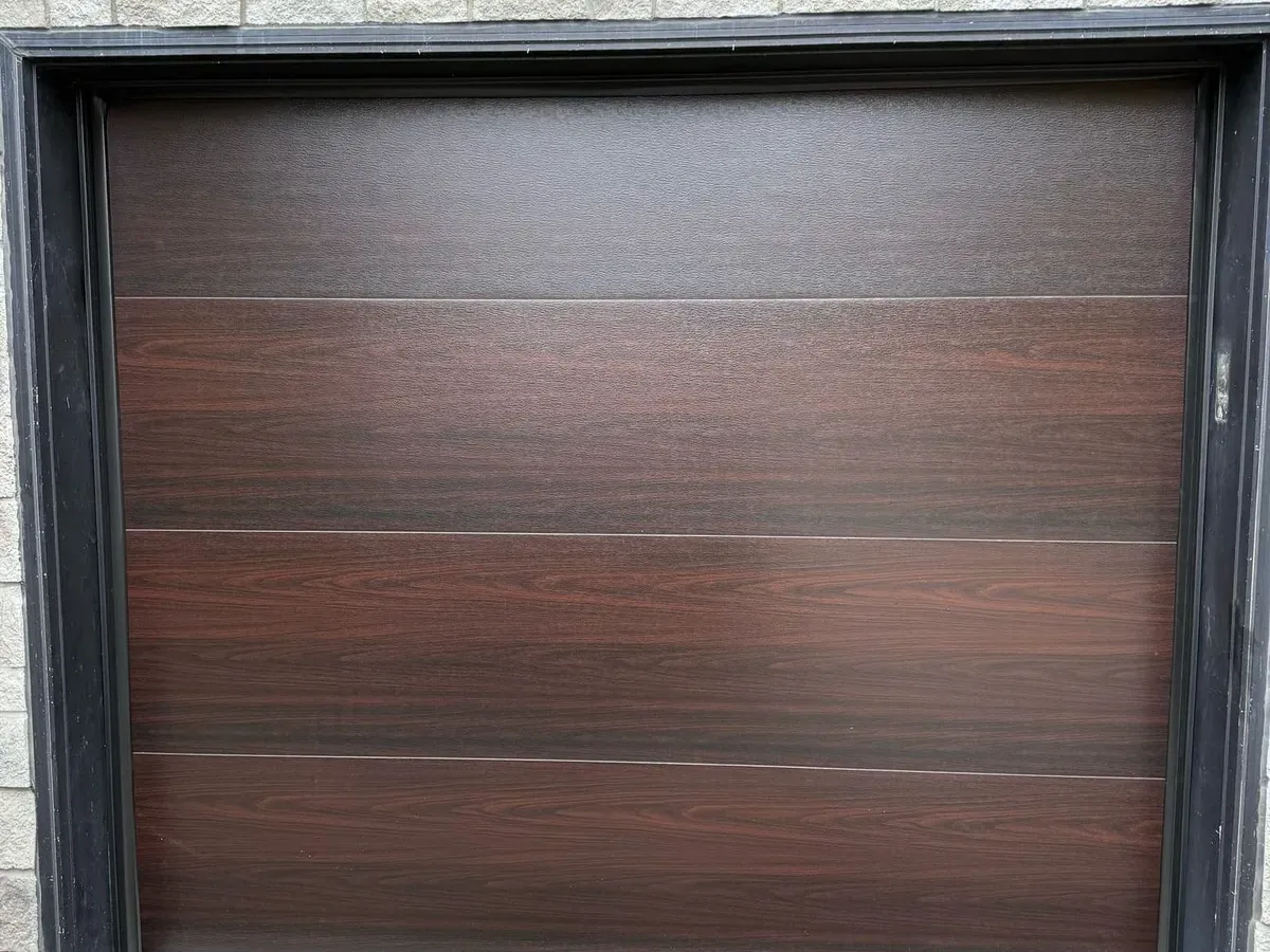 Espresso woodgrain flush-panel garage door — Vaughan