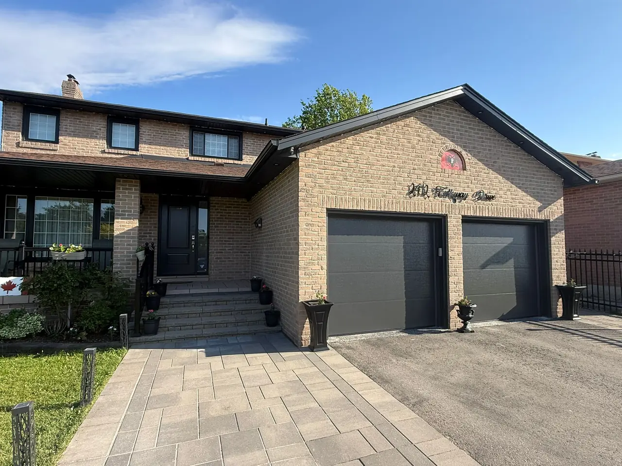 Graphite modern flush-panel double garage door installation — GTA