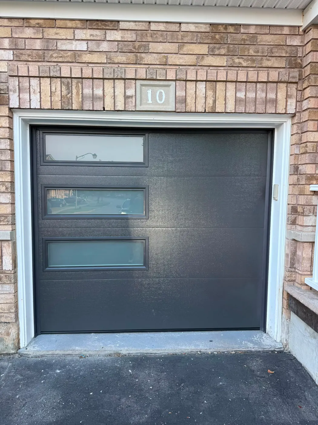 Graphite modern flush-panel single garage door with side windows — GTA