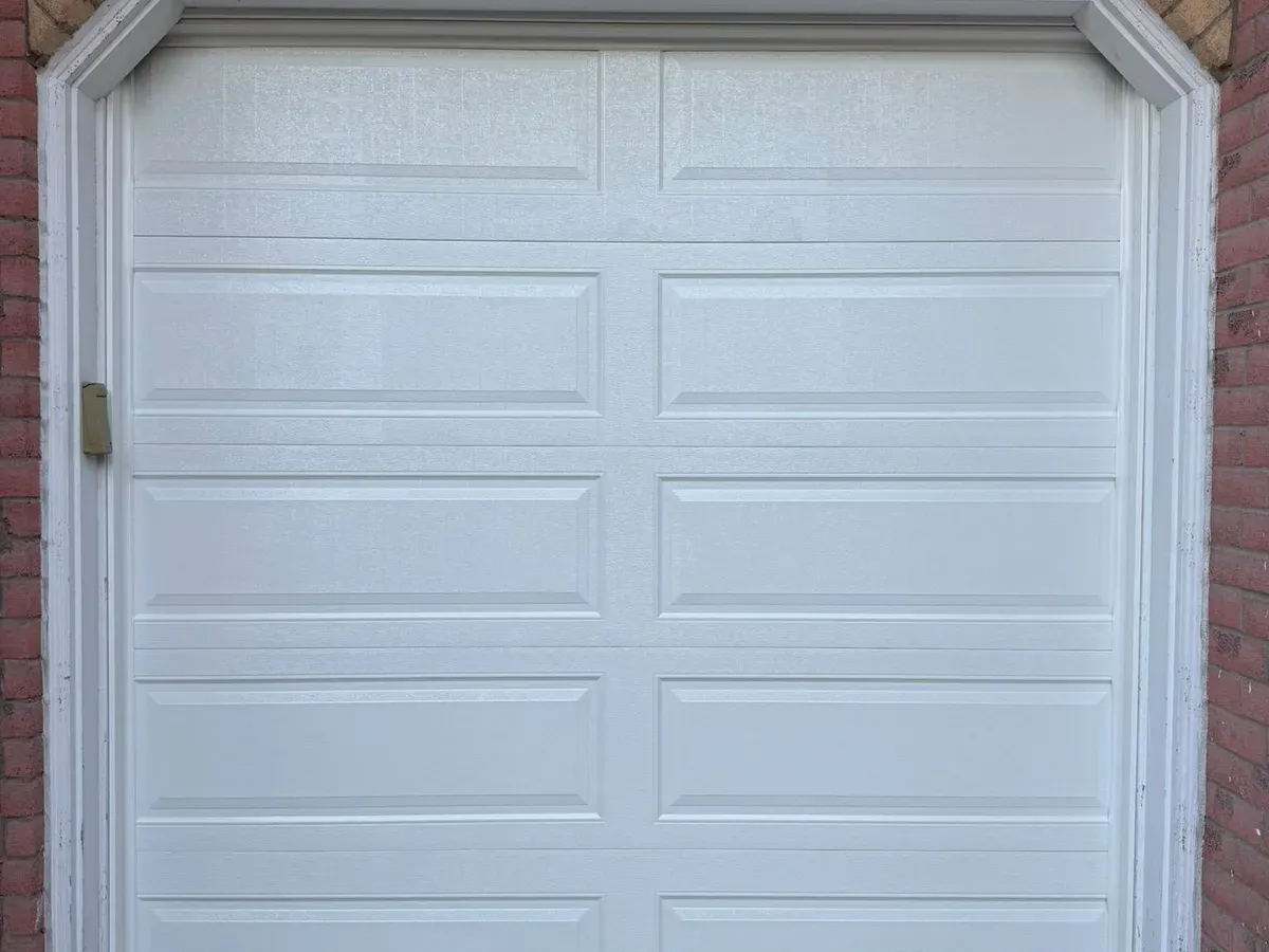 Grey double garage door with glass inserts — Mississauga