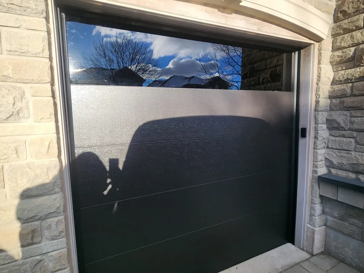 Modern garage door with frosted glass panel — Toronto