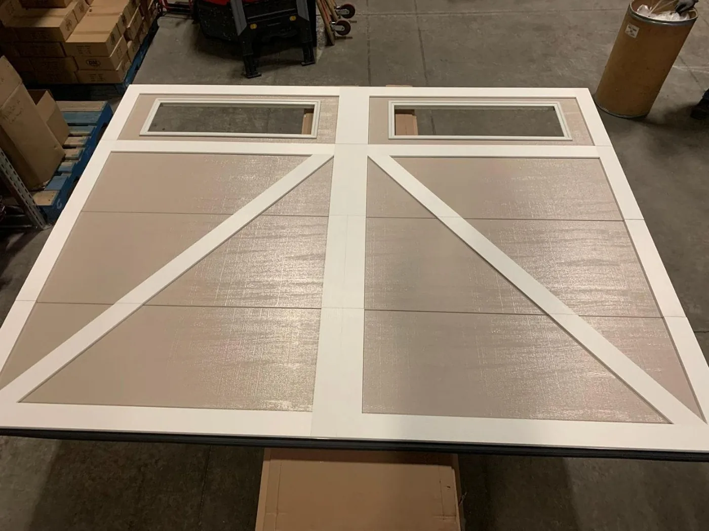 Sandstone carriage overlay garage door being custom-fabricated