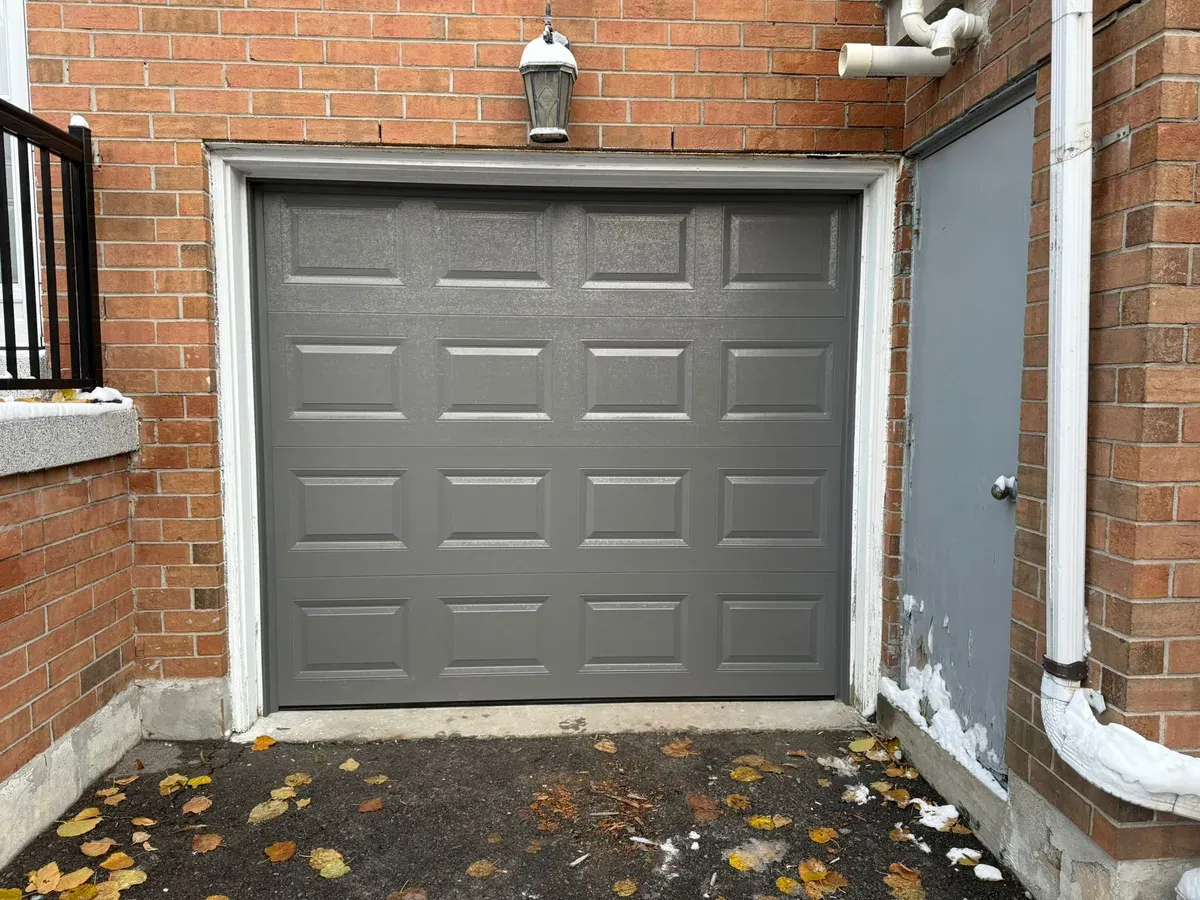 Steel garage door with decorative hinges and handles — Toronto