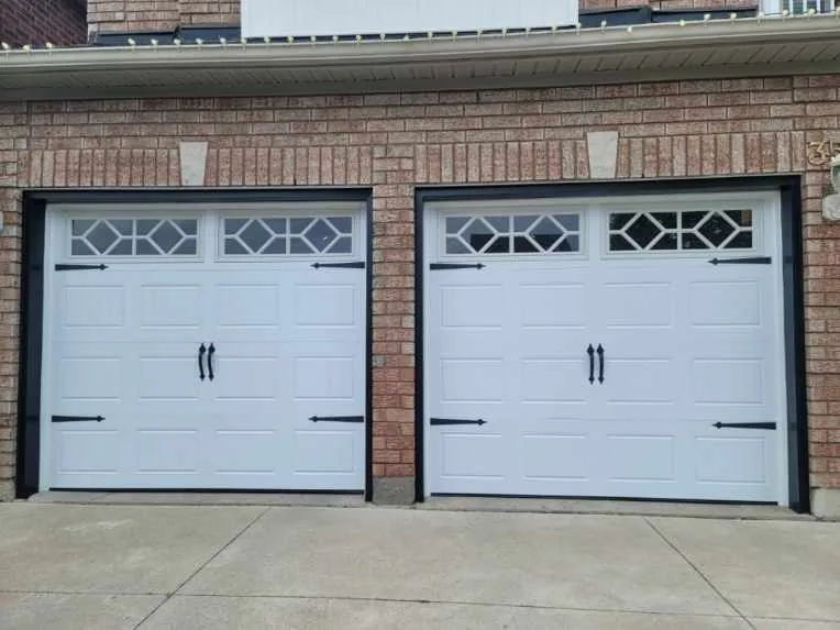 White carriage-style double garage door with diamond windows — GTA