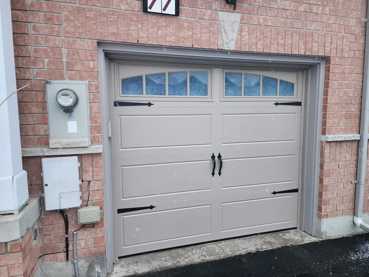 White insulated garage door with transom windows — Etobicoke