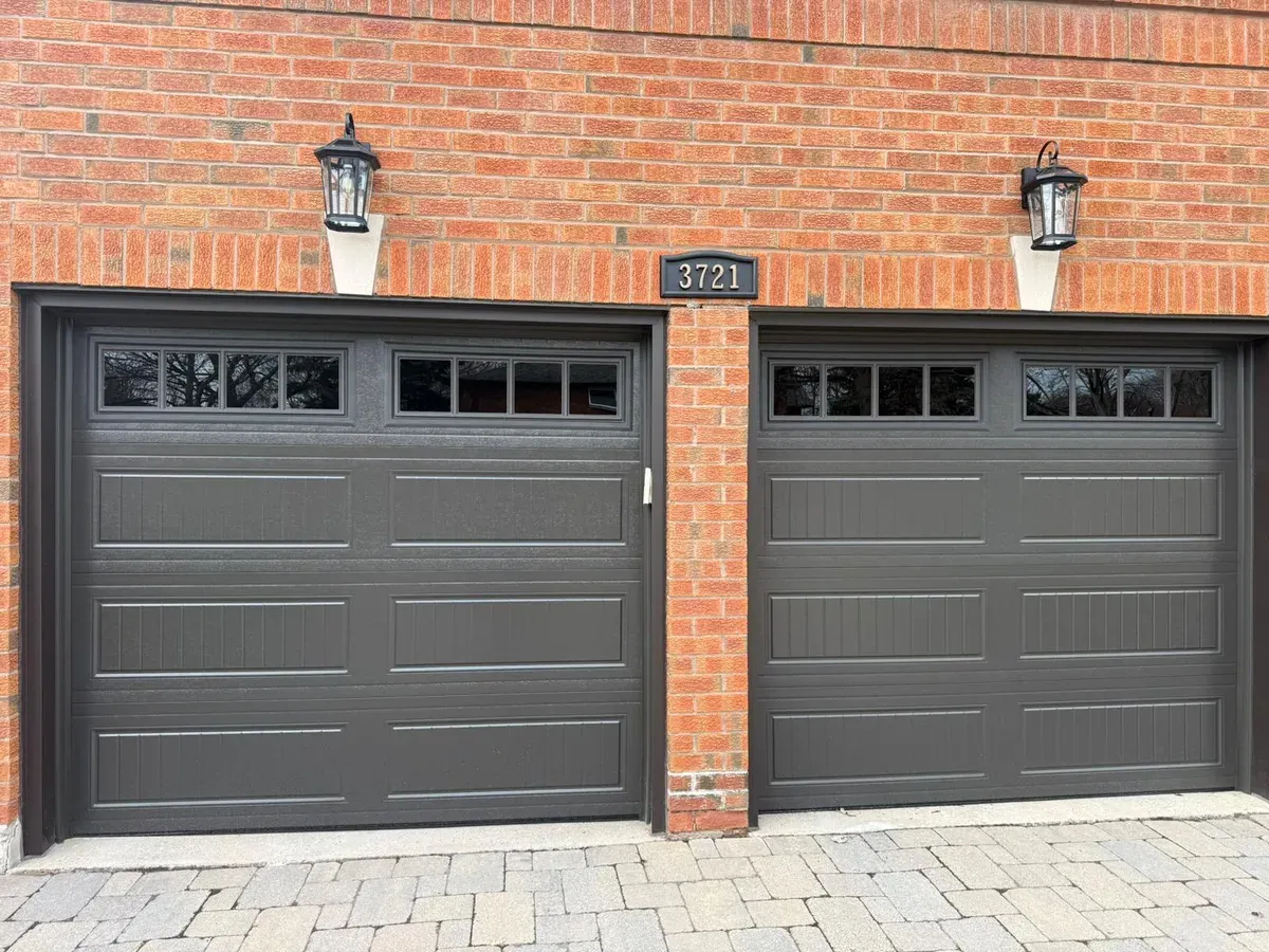 White raised-panel garage door replacement — Etobicoke